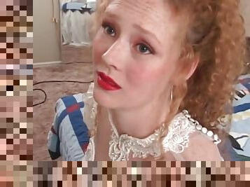 Redhead in wedding dress models her pussy