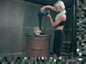 Kinky lesbian blonde mistress London River pours hot wax on her slave