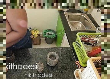 Nude girl dish wash in kitchen