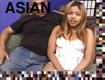 Young Asian slut with big tits rides a big cock